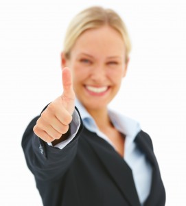 Beautiful happy blond business woman showing thumbs up isolated on white background